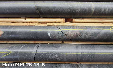 Drill core from ESGold hole MM-26-19 (photo B) at 30.7 metres, showing quartz-carbonate veining with pyrrhotite